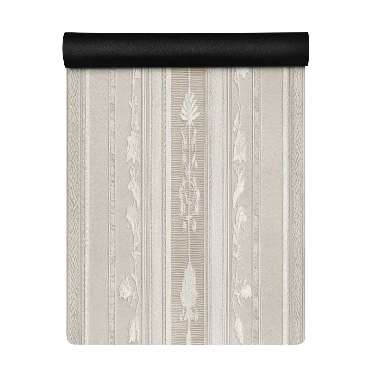 Close-up view of a beige yoga mat with a floral pattern, partially unrolled to reveal intricate details.