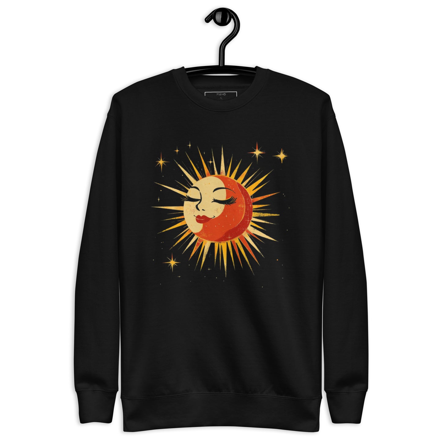 Black sweatshirt featuring a vintage-style sun and moon design with golden rays and stars, displayed on a hanger.