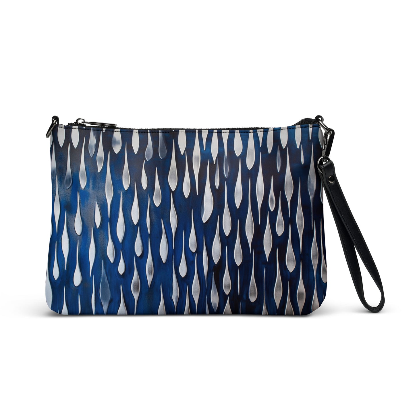 Blue crossbody bag with teardrop pattern, featuring a detachable strap and sleek design