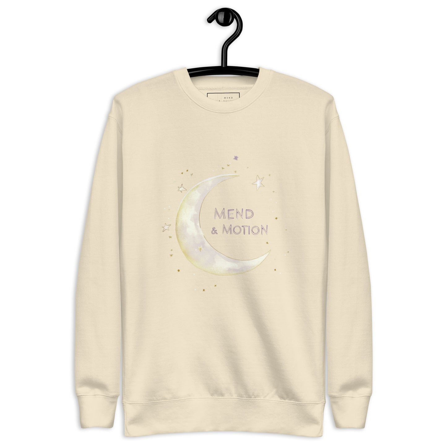 Bone-colored sweatshirt featuring a crescent moon and "Mend & Motion" text with star accents
