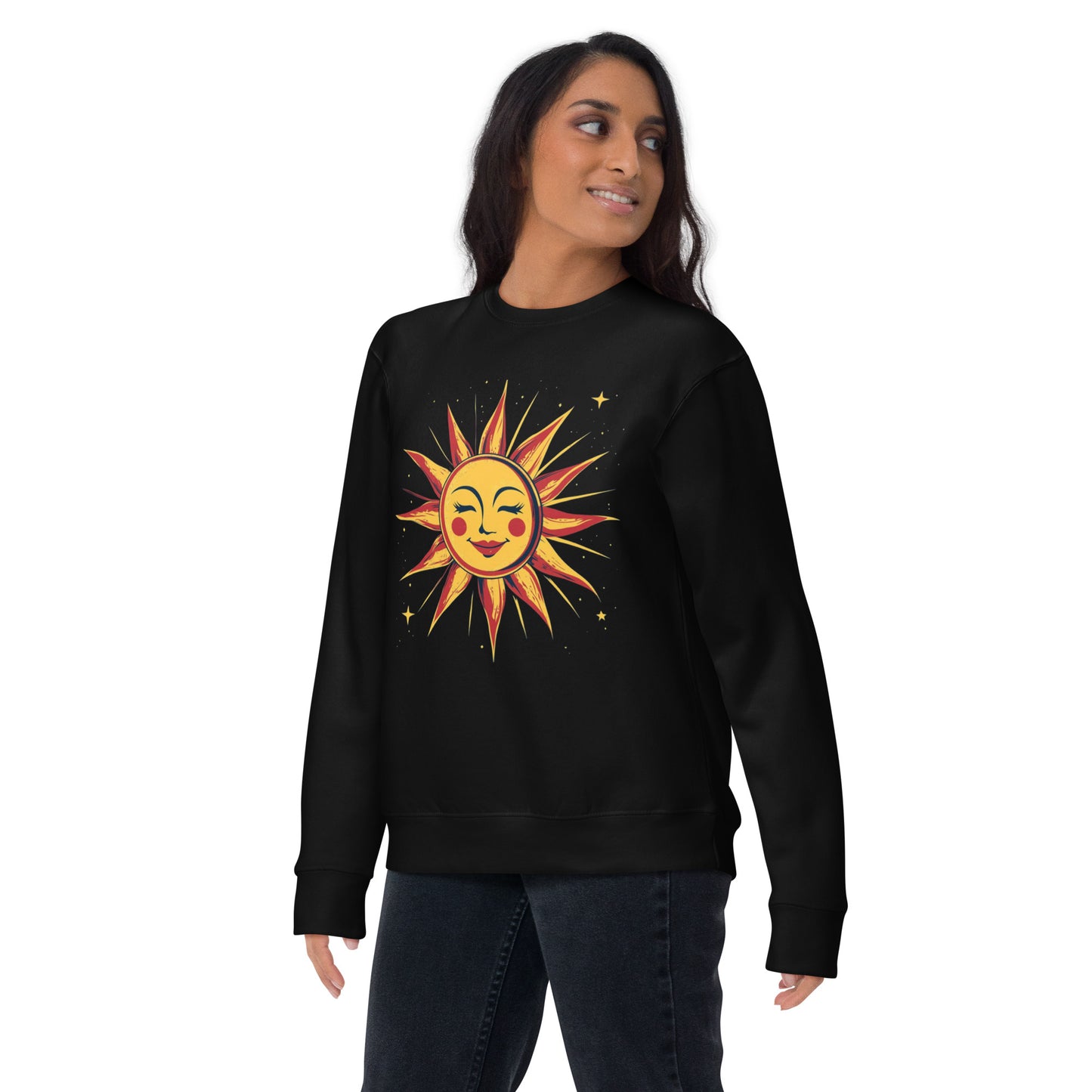Woman wearing a black sweatshirt featuring a vibrant celestial sun design, adding a bold and artistic touch to her casual outfit