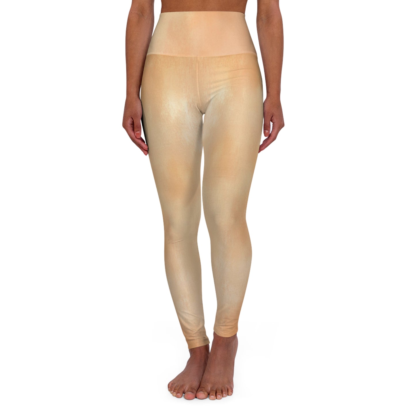 Front view of light gold high-waisted leggings, highlighting their flattering cut and sleek fabric.