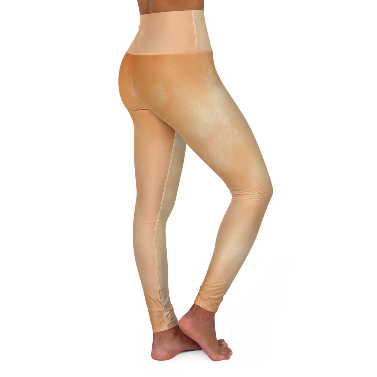 Side view of light gold high-waisted leggings, showcasing their smooth fit and seamless design.