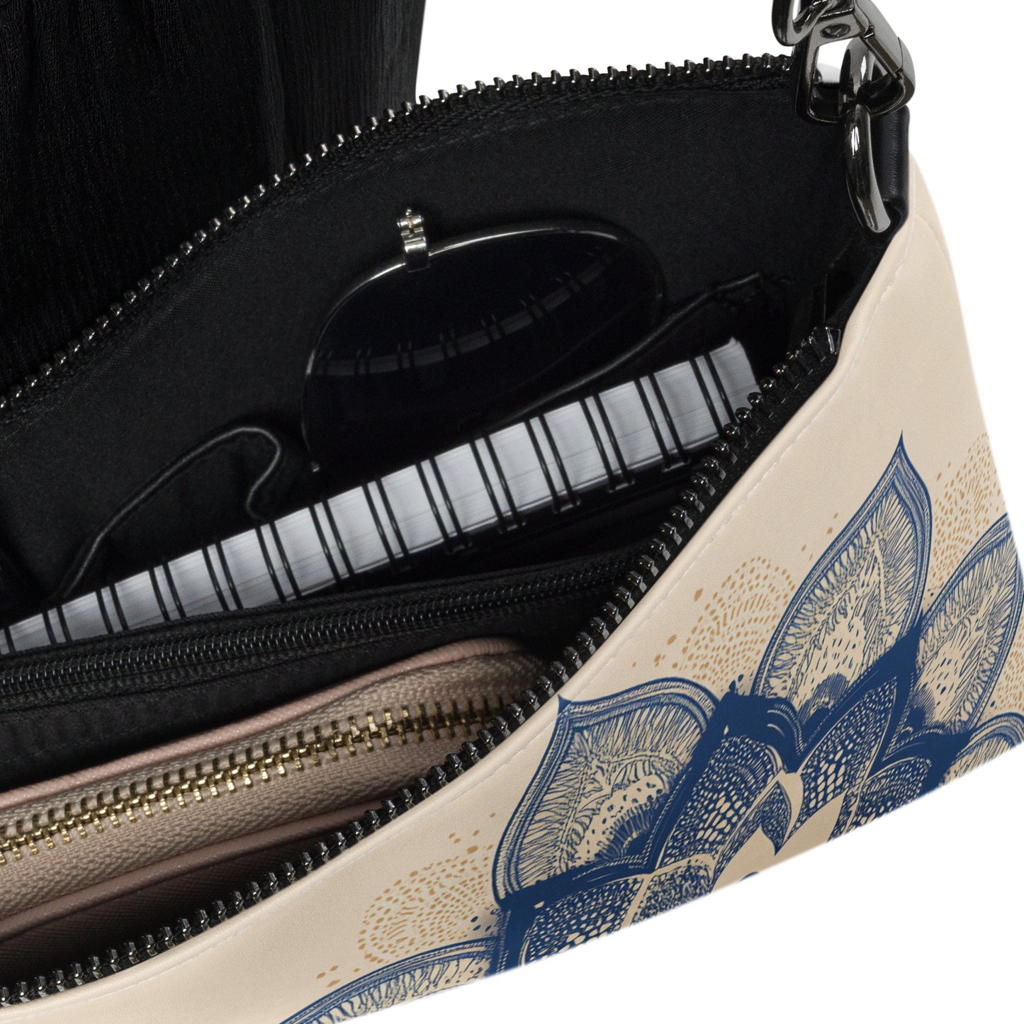 Interior view of the Mend & Motion crossbody bag with zippered compartments and sleek organizational features