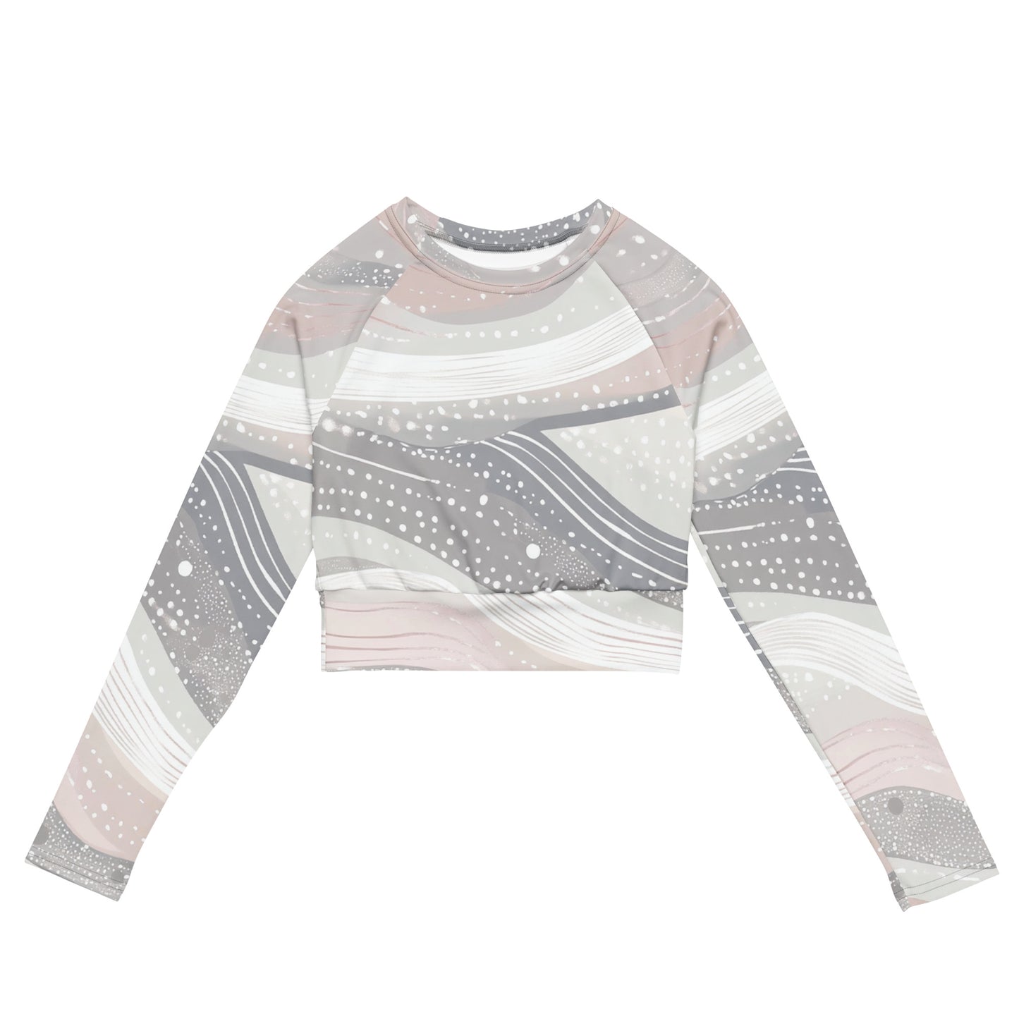 Front view of a long-sleeve recycled crop top featuring a soft pastel abstract pattern with flowing lines and dots, perfect for a modern athleisure look.