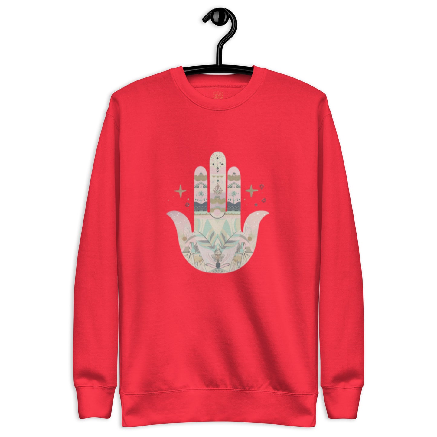 A bright red sweatshirt featuring a pastel-colored Hamsa hand design with floral and geometric elements, displayed on a hanger.