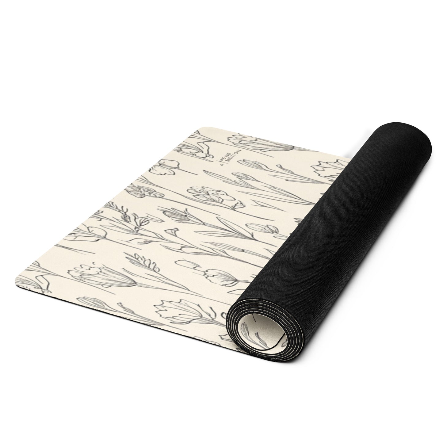 Rolled beige yoga mat with a floral sketch design of tulips and wildflowers, featuring a black underside for non-slip grip