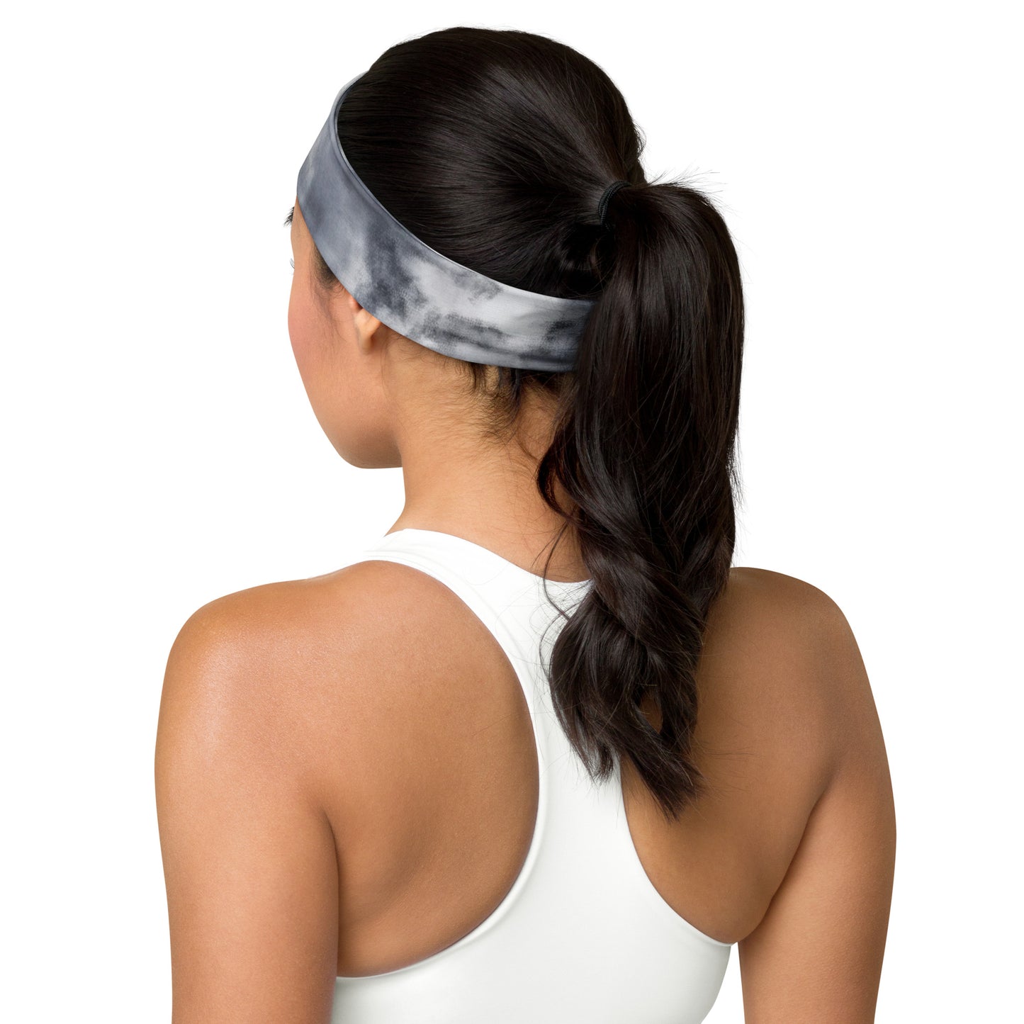 Rear view of a model wearing a tie-dye headband in gray and white, showcasing its comfortable fit and stylish design