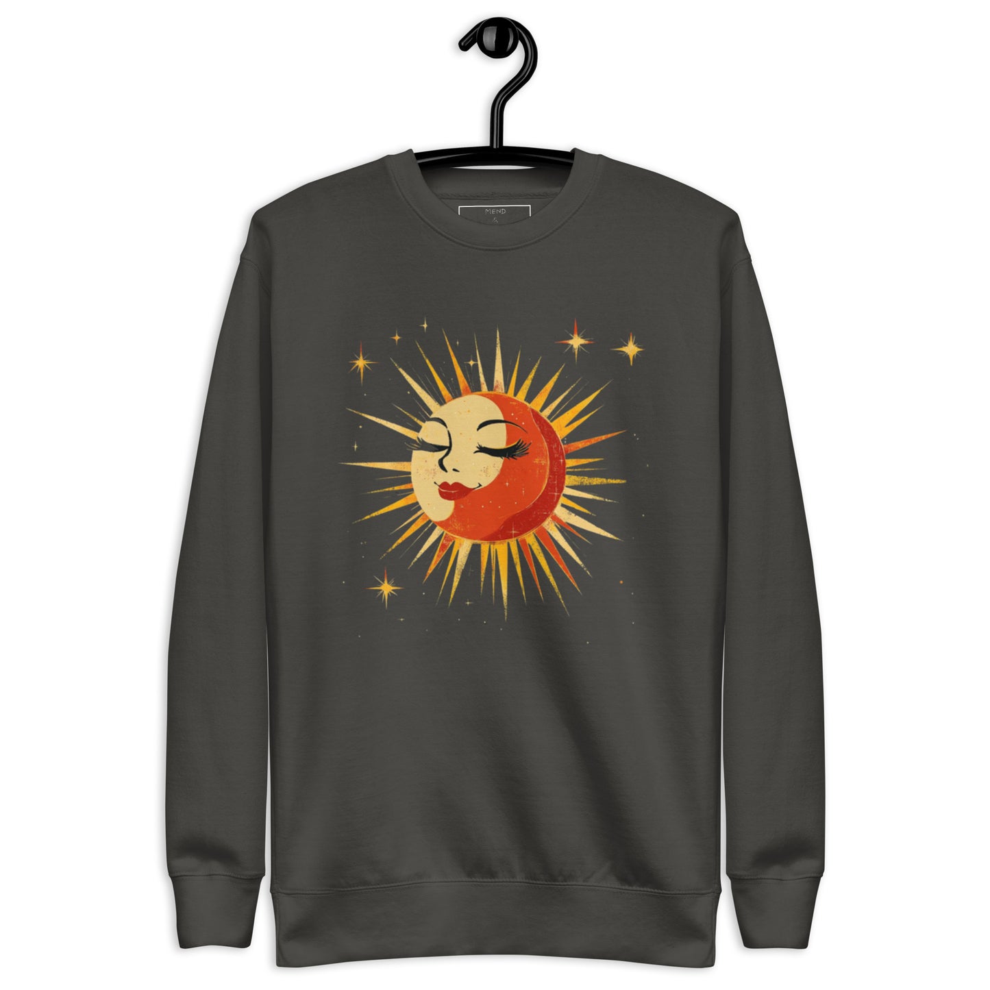 Vintage black sweatshirt displaying a radiant sun and moon graphic surrounded by a field of stars.