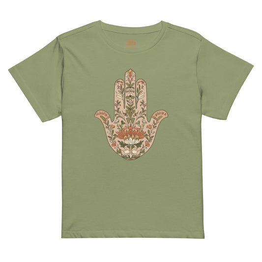 Black high-waisted tee with beige and orange floral Hamsa design.