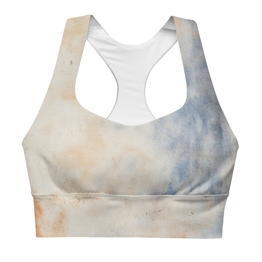 Front view of a sports bra with a soft beige and blue gradient design.
