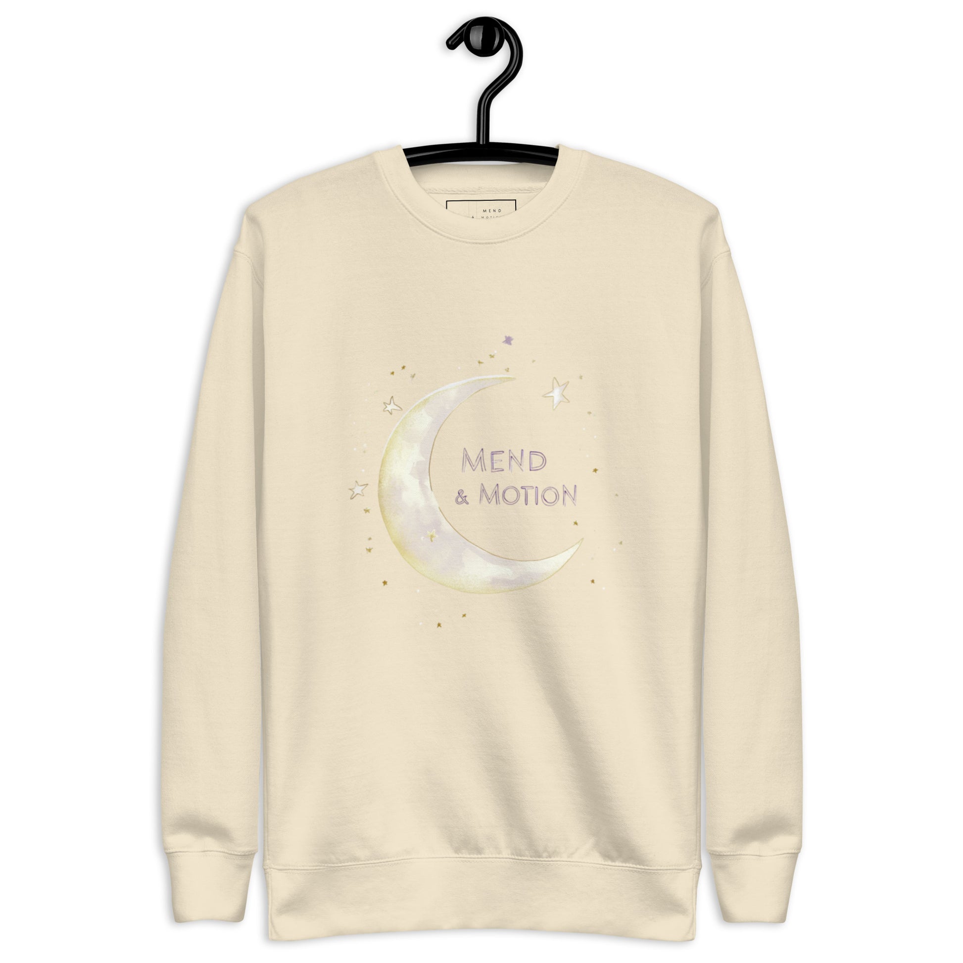  Bone-colored sweatshirt featuring a crescent moon and "Mend & Motion" text with star accents