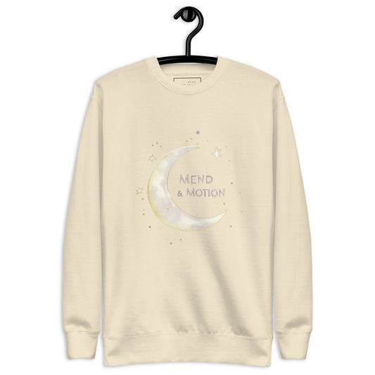  Bone-colored sweatshirt featuring a crescent moon and "Mend & Motion" text with star accents