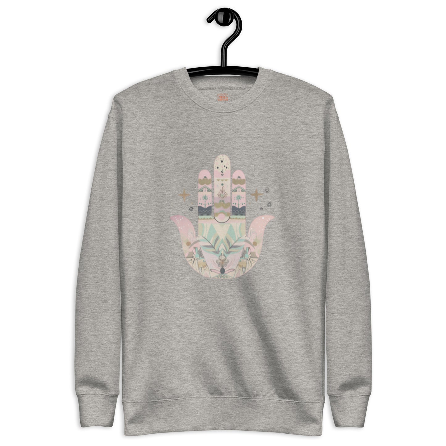 A light grey sweatshirt featuring a pastel-colored Hamsa hand design with floral and geometric elements, displayed on a hanger.
