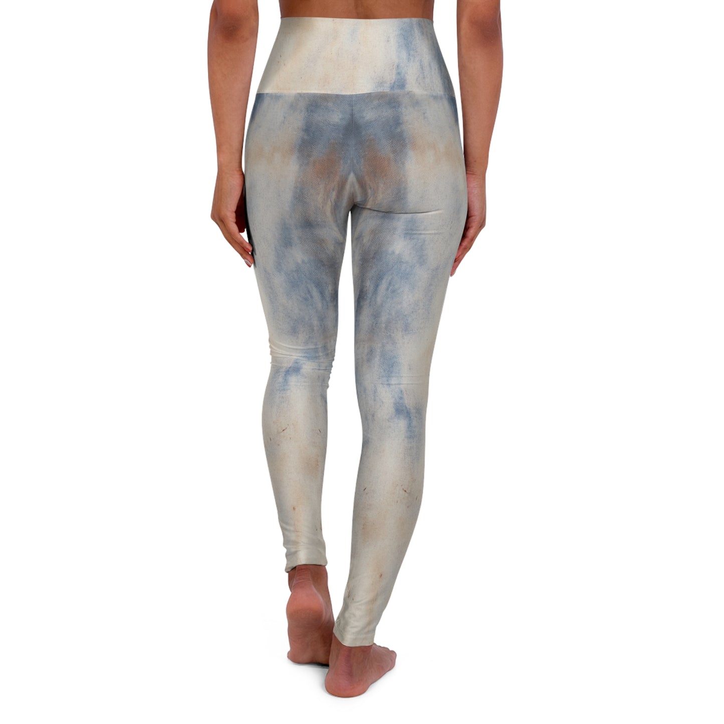 Back view of distressed high-waisted leggings in a vintage washed pattern