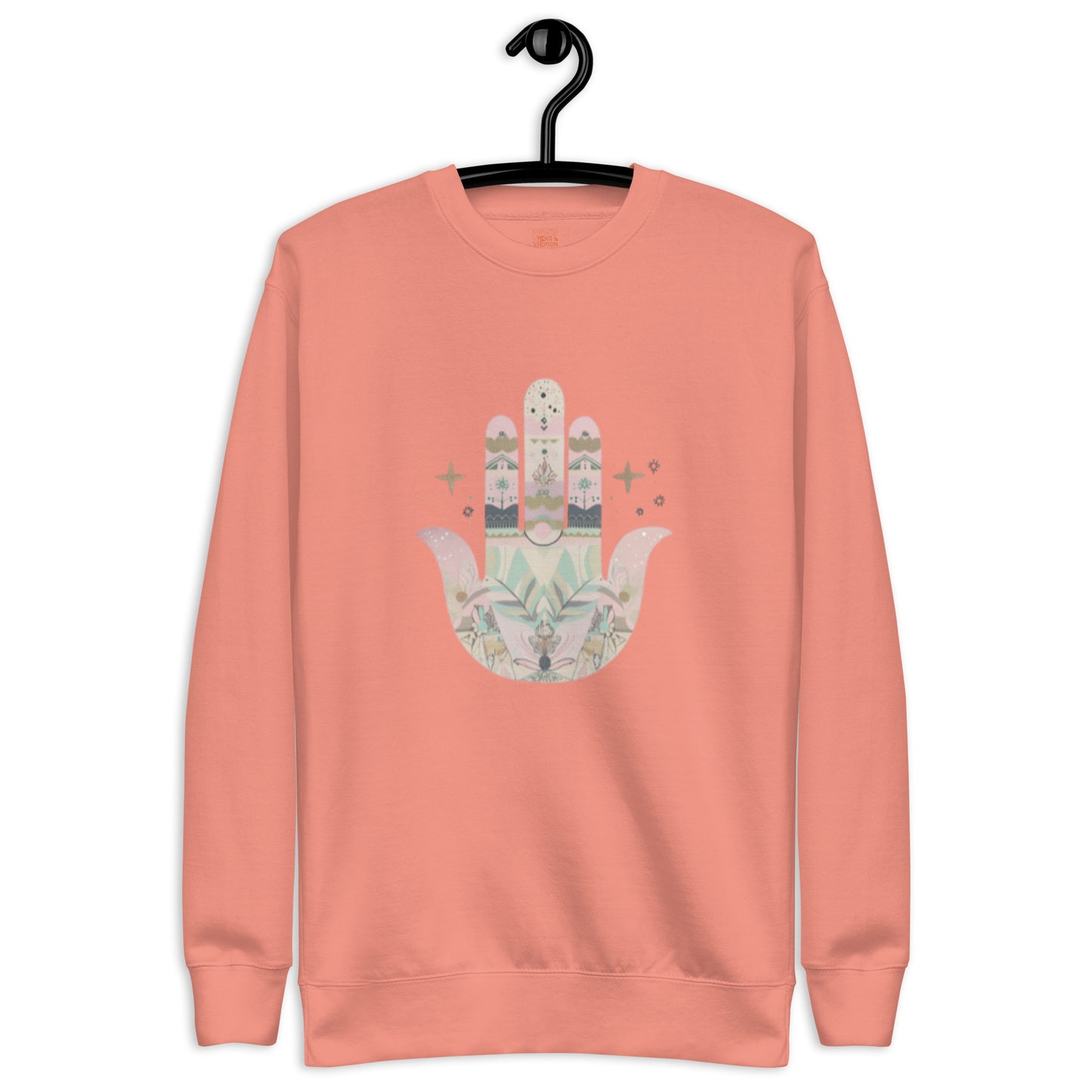 A dusty rose sweatshirt featuring a pastel-colored Hamsa hand design with floral and geometric elements, displayed on a hanger.