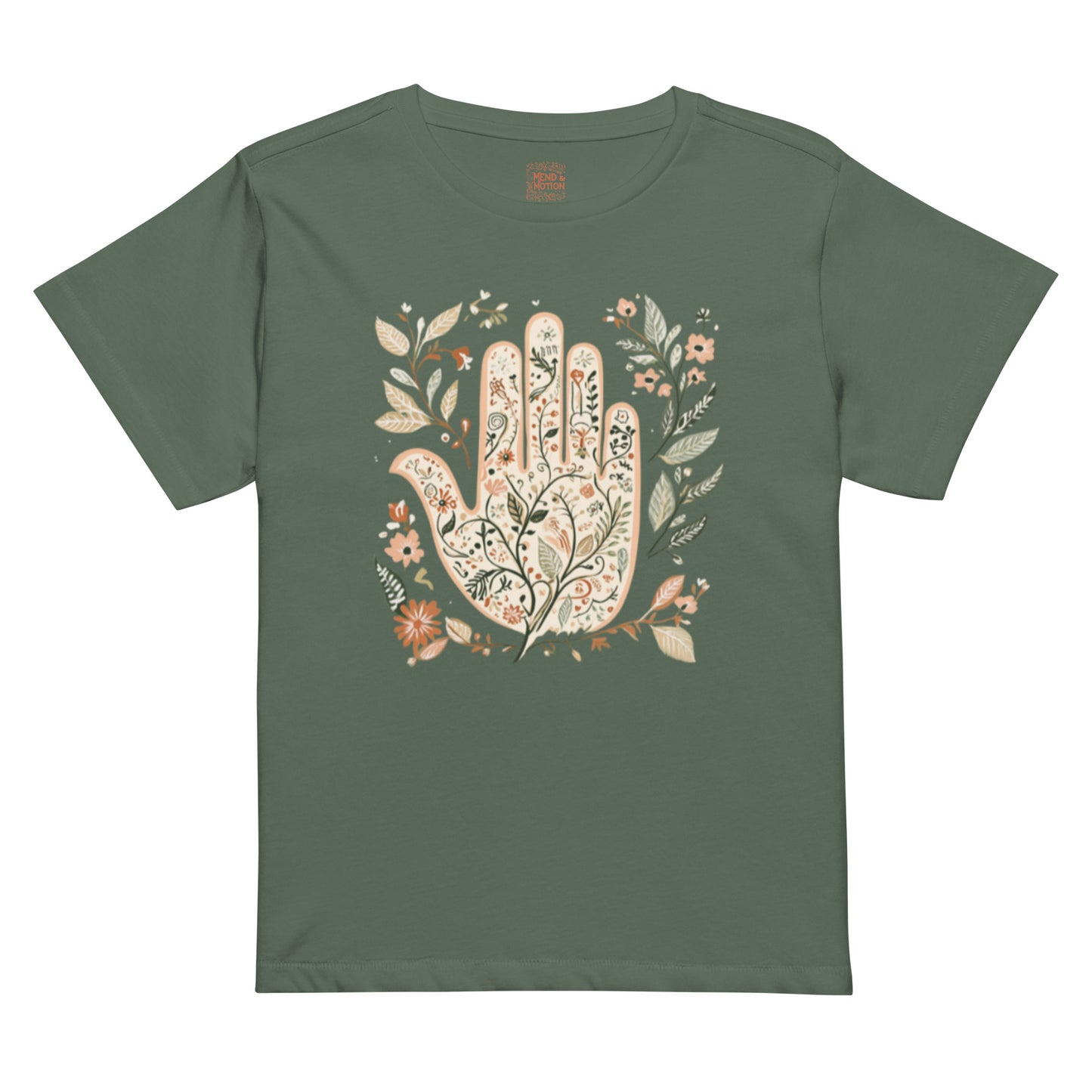 Pine green high-waisted tee showcasing a floral Hamsa hand surrounded by botanical details.
