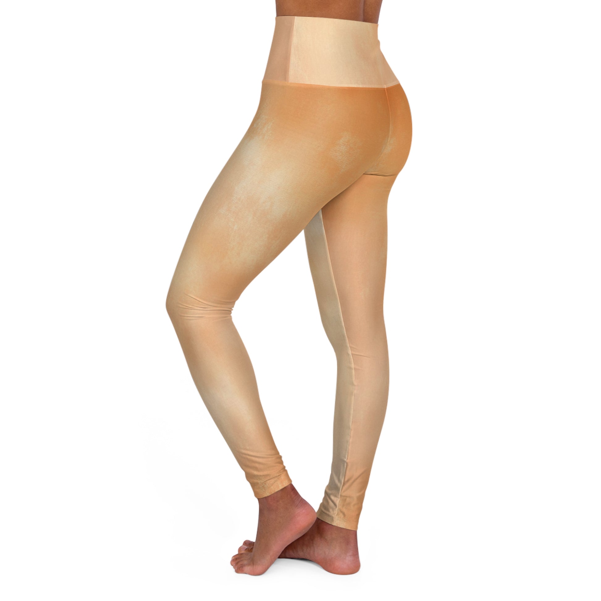 Side view of light gold high-waisted leggings, emphasizing their comfortable fit and streamlined appearance.