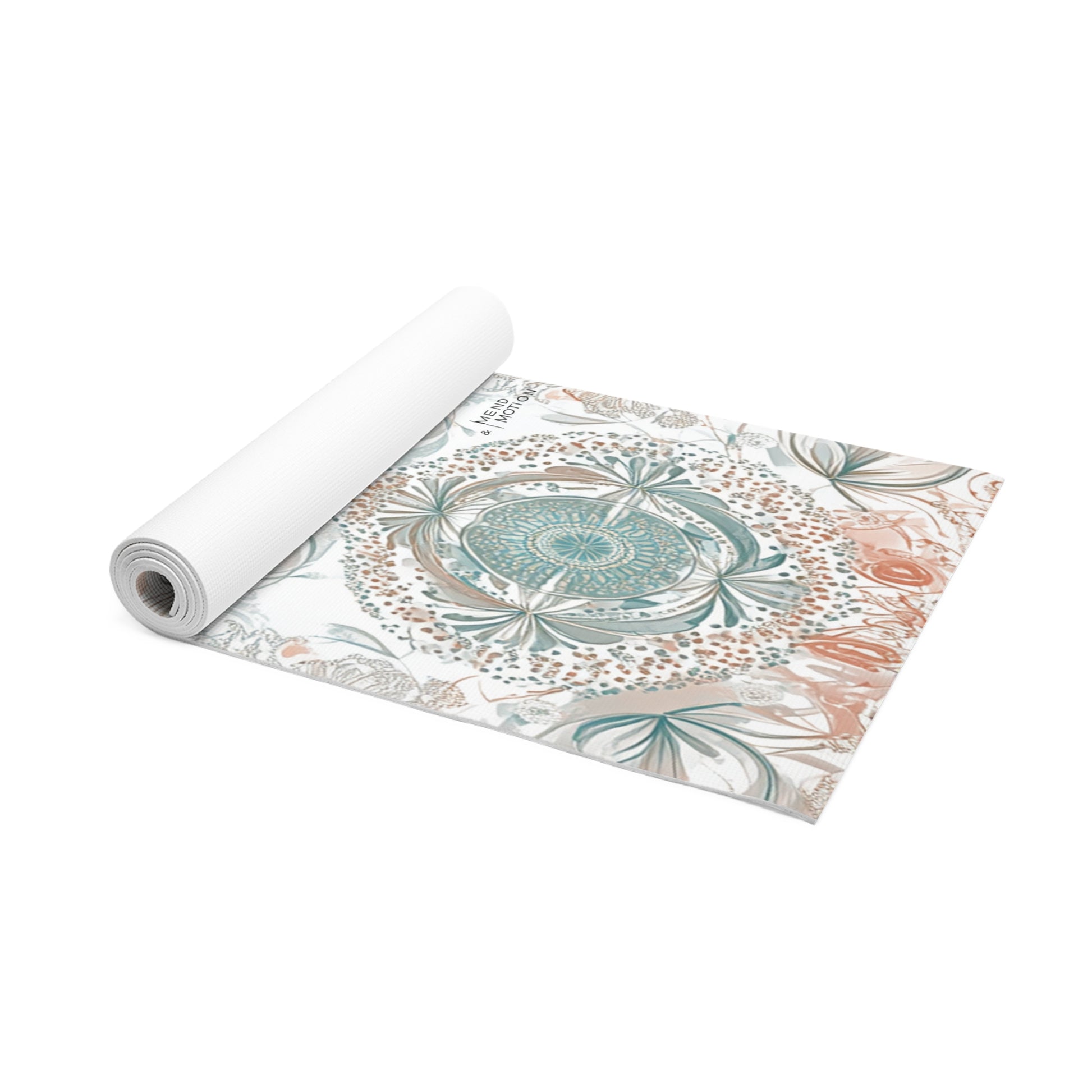 Rolled yoga mat showcasing a mandala design in teal and beige on a white background