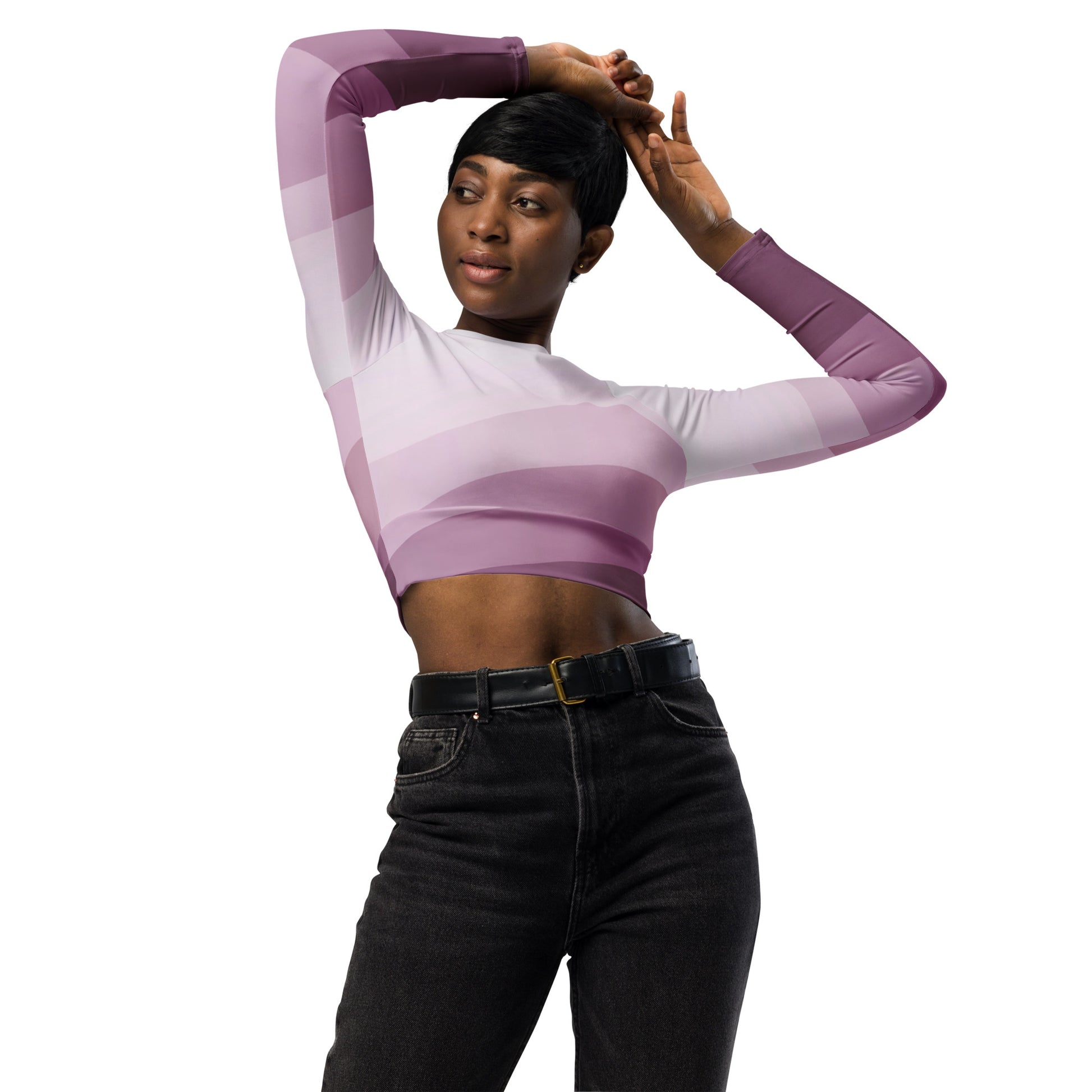 Model wearing a purple gradient long sleeve crop top paired with black high-waisted jeans, posing with arms raised.