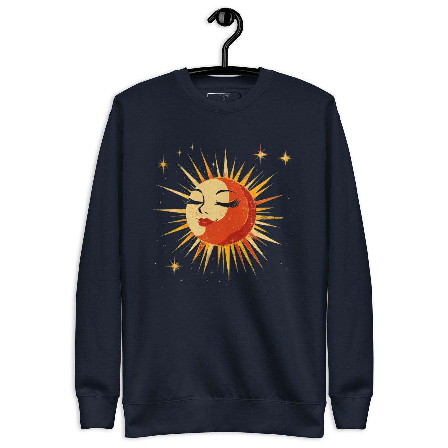 Navy sweatshirt hanging with a prominent sun and moon design surrounded by stars and golden rays.