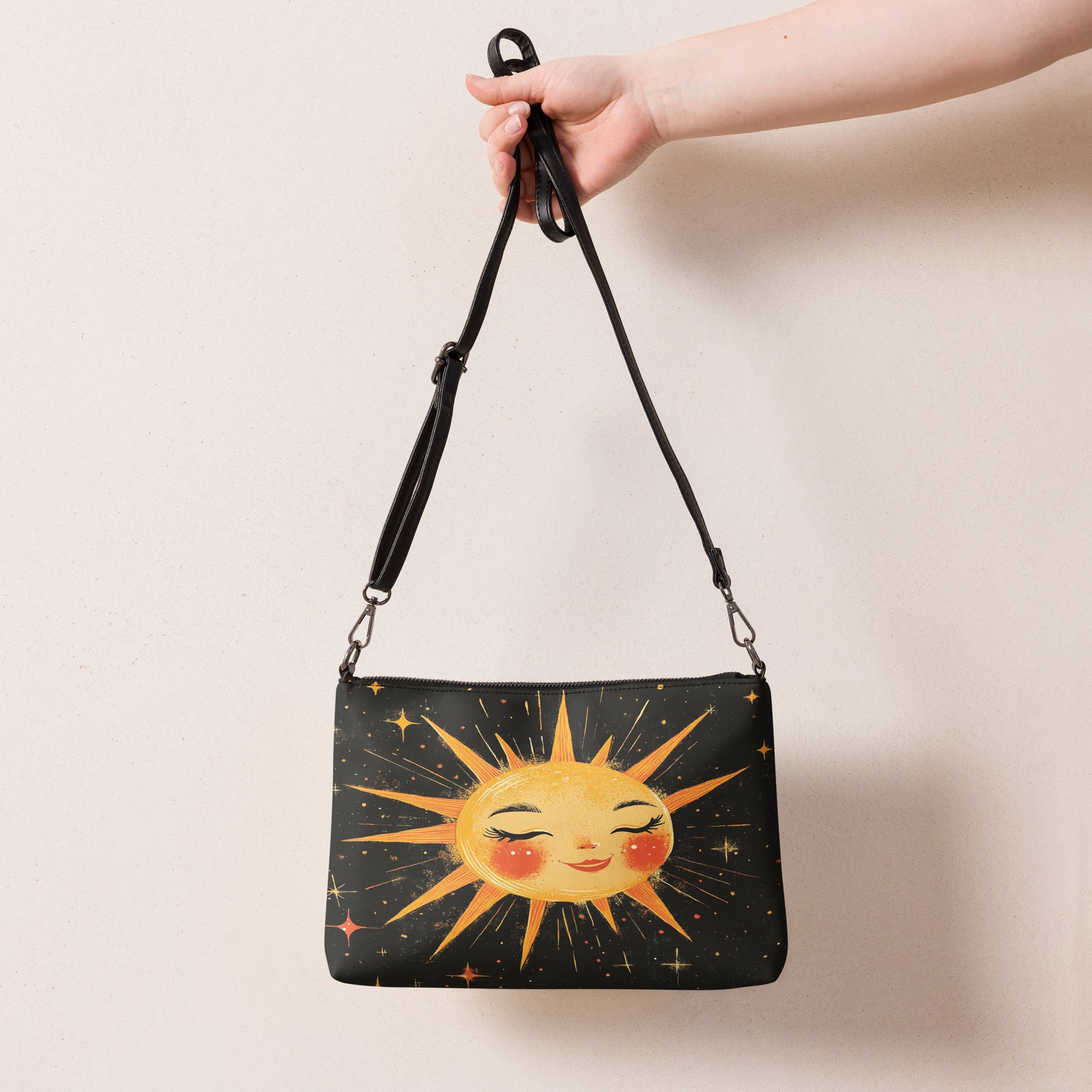 Back view of a black crossbody bag with a minimal, celestial-themed design, perfect for everyday use