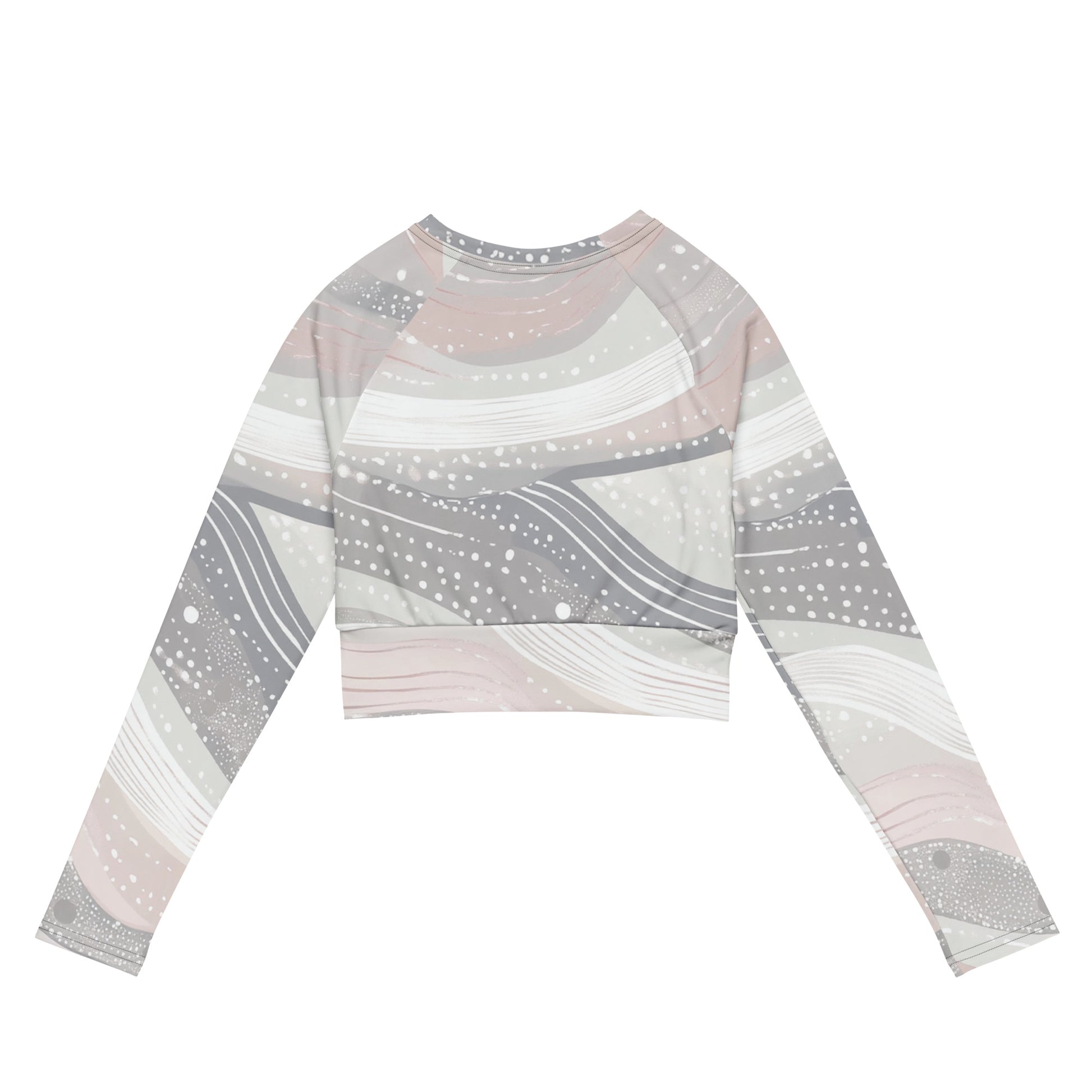 Back view of a long-sleeve recycled crop top showcasing a pastel abstract design with smooth waves and dotted accents, combining style and sustainability.