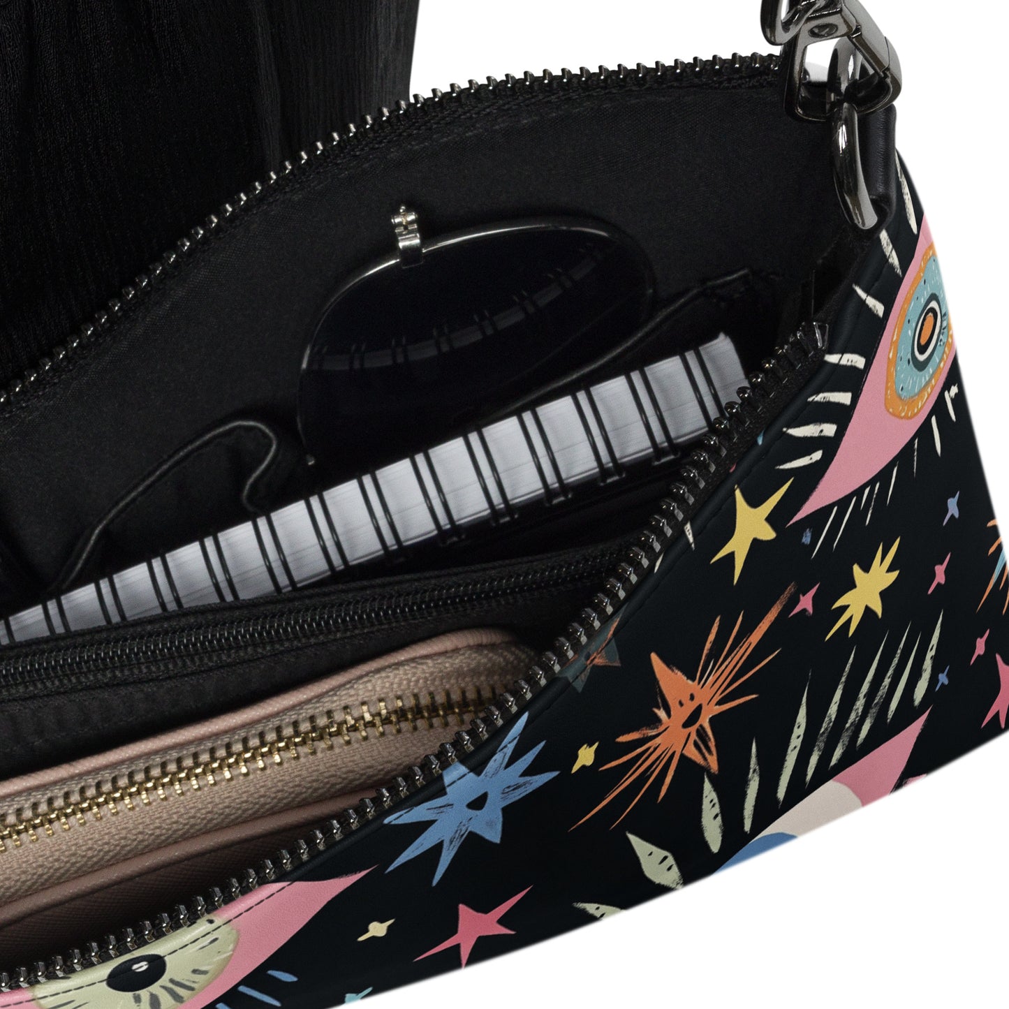 Inside view of the crossbody bag with zippered compartments and organized space for essentials