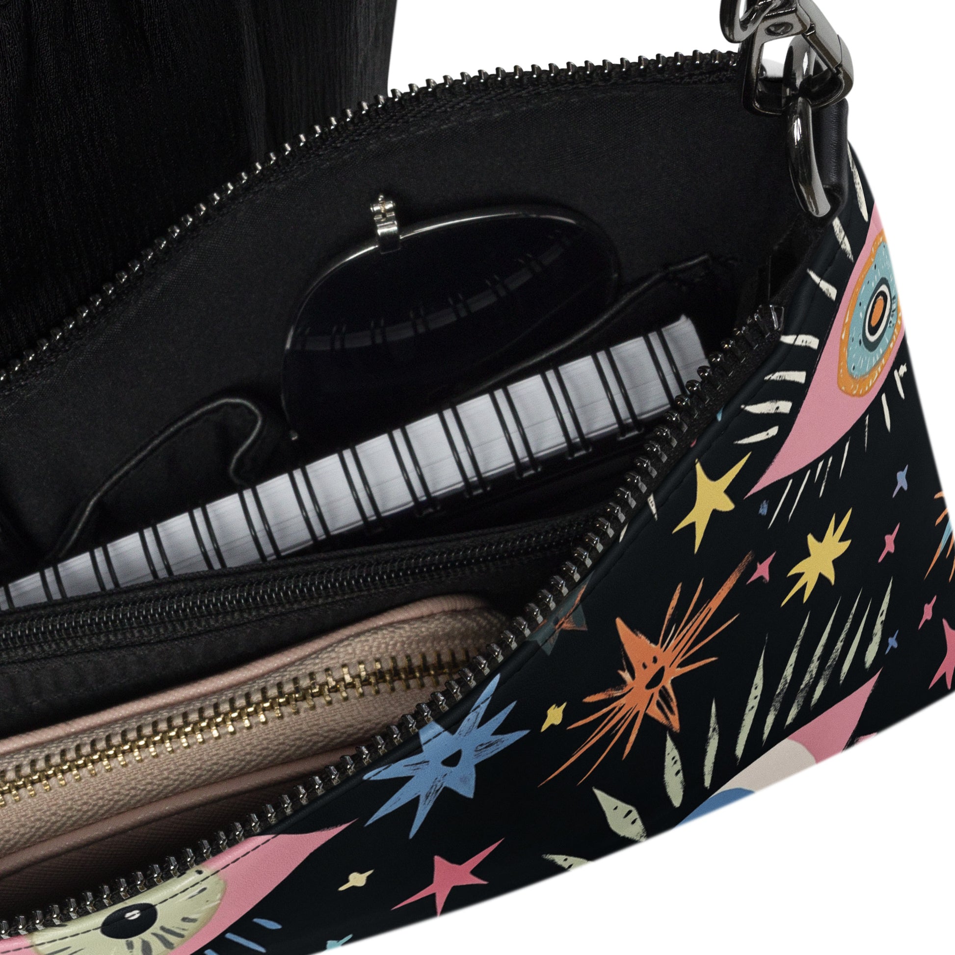 Inside view of the crossbody bag with zippered compartments and organized space for essentials