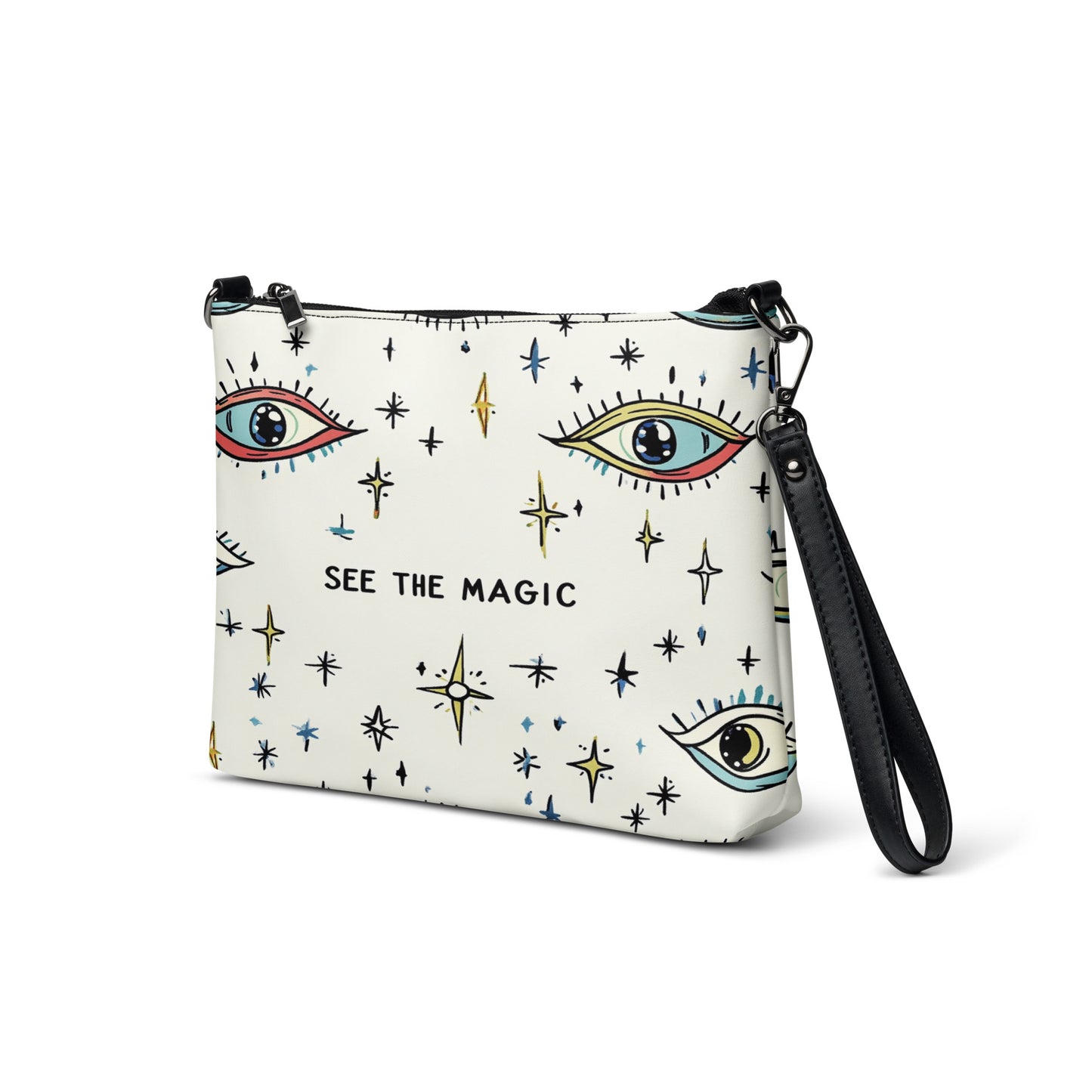 Side view of the 'See the Magic' crossbody bag showcasing its celestial-themed design and wrist strap