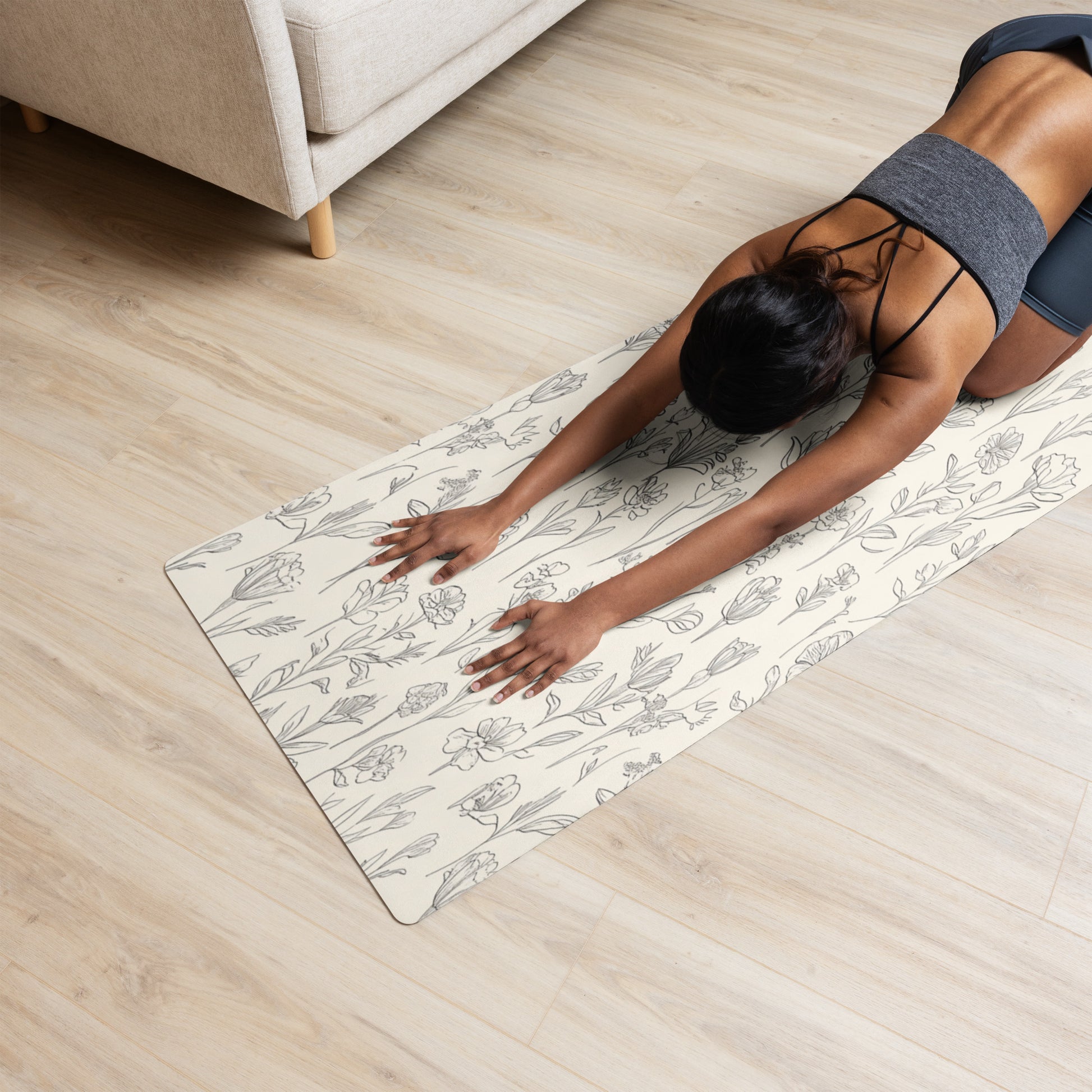  Beige yoga mat with a delicate floral sketch pattern featuring tulips and other wildflowers, laid flat to showcase the full design
