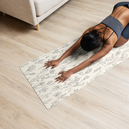  Beige yoga mat with a delicate floral sketch pattern featuring tulips and other wildflowers, laid flat to showcase the full design