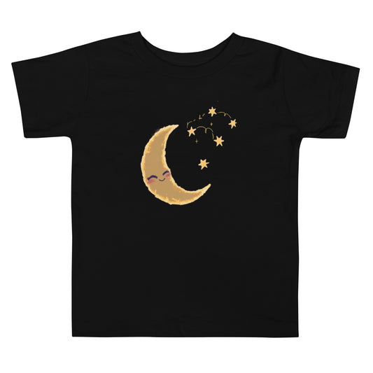 A black toddler T-shirt featuring a crescent moon with a sleepy face and stars in yellow and gold tones