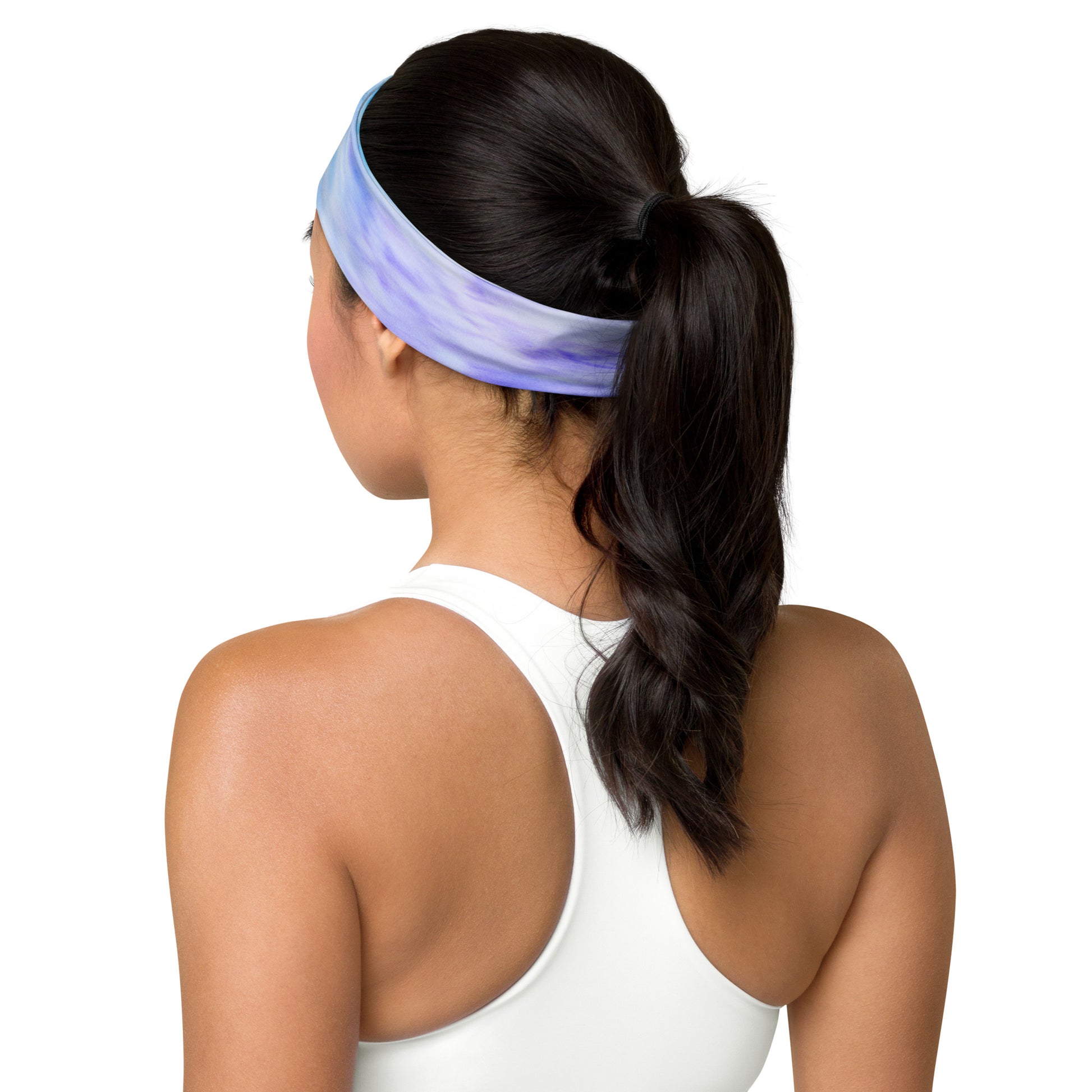 Rear view of a model wearing a tie-dye headband in gray and white, showcasing its comfortable fit and stylish design