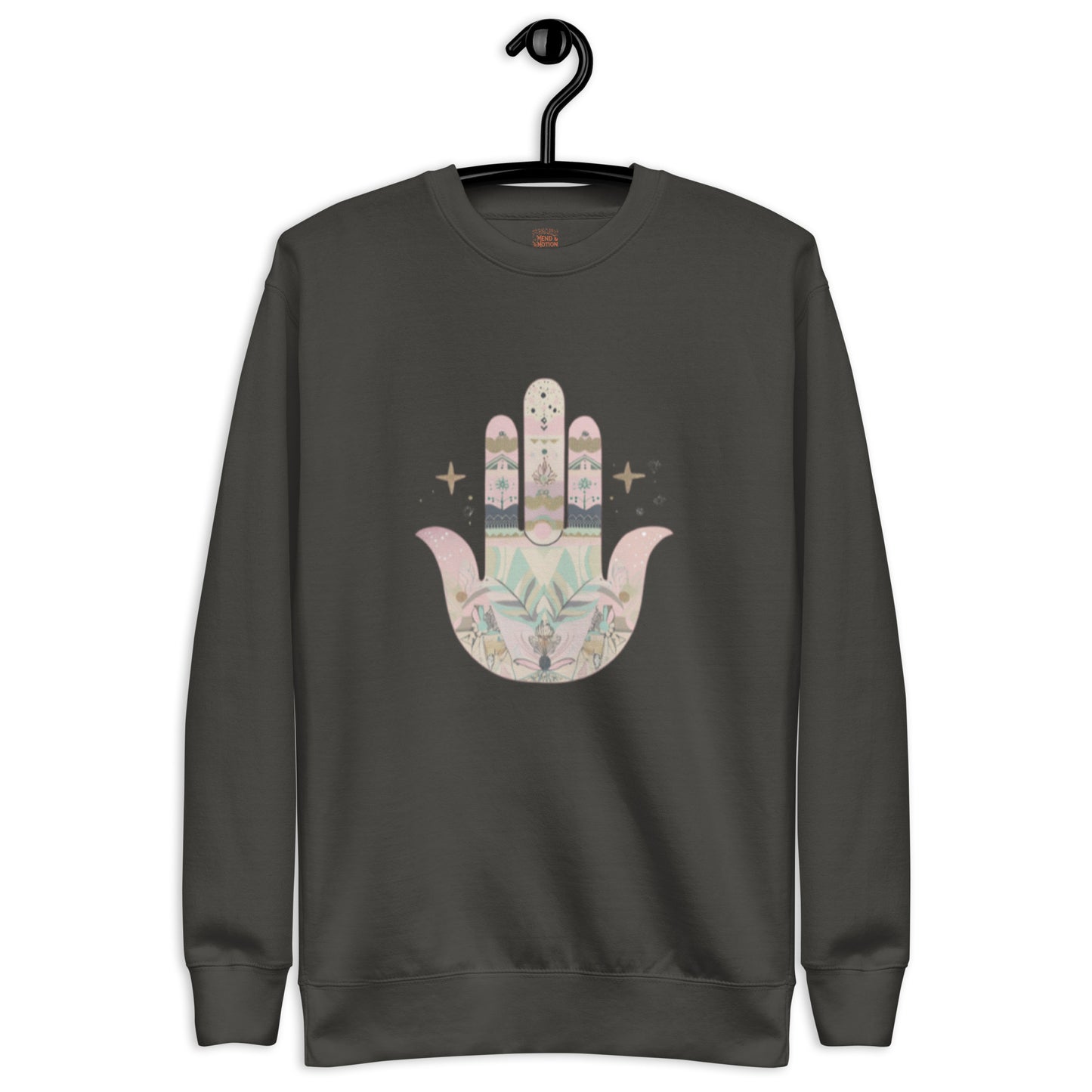 A faded black sweatshirt featuring a pastel-colored Hamsa hand design with floral and geometric elements, displayed on a hanger.